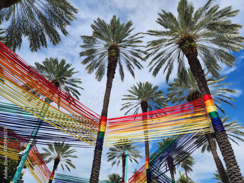 Palm tree. Summer vacation in South beach, Florida. Palm tree of Miami. Miami beach LGBT rainbow. Tropical pride scene with palm tree. LGBT Pride parade. Pride installation in Miami. Rainbow color