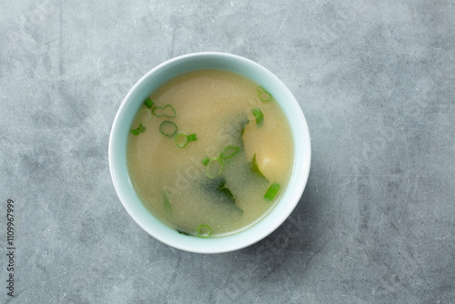 A top down view of a bowl of miso soup.