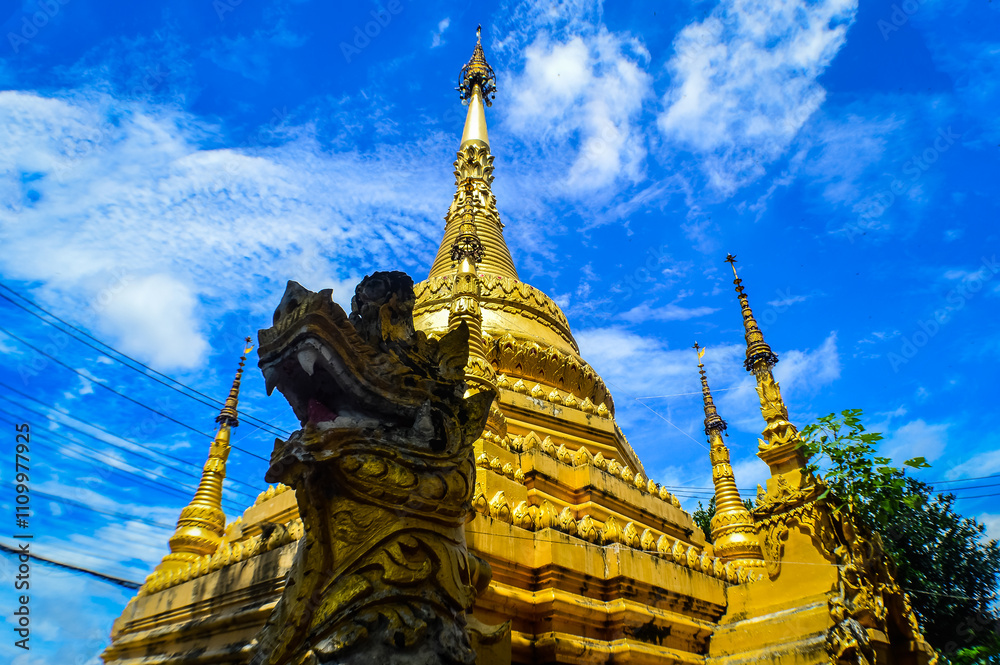Fototapeta premium Gold Pagoda, Lanna Architecture, Symbols of Buddhism, South East Asia at Ko Klang temple, Muang Chiang Mai, Chiang Mai, Northern Thailand