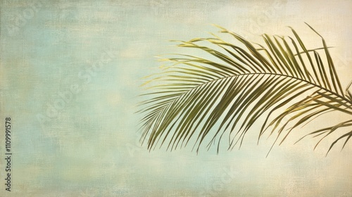 Palm frond against a textured teal sky.