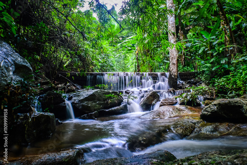 Beautiful Small Waterfall in Green Forest in jungle at Pha Lat Temple (Sakithaka),Chiang Mai, Northern Thailand photo