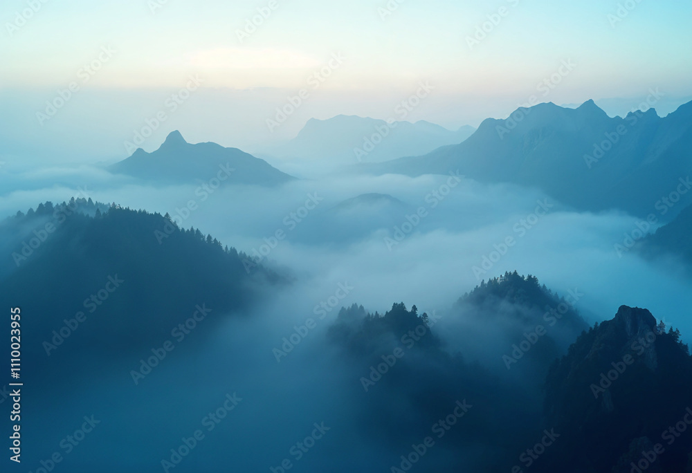 Naklejka premium Fog and mountains in the morning high angle form drone