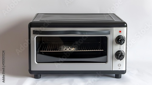 A compact toaster oven with a glass door and control knobs for cooking and baking.