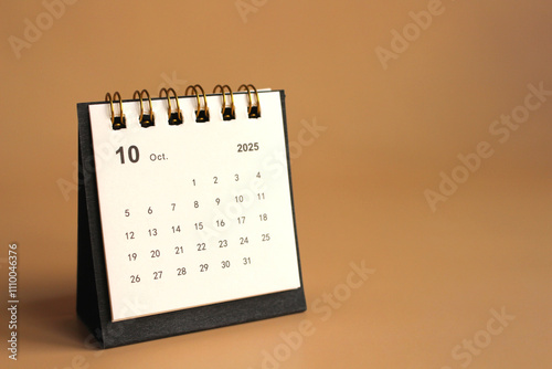 Monthly calendar template for the new year 2025 desk calendar,isolated on Beige background. photo