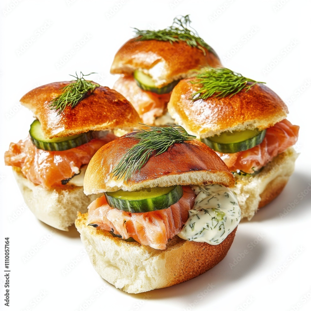 A trio of sliders featuring salmon, dill aioli, and cucumber slices A trio of sliders featuring salmon, dill aioli, and cucumber slices