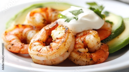 Grilled Shrimp with Avocado and Sour Cream on a White Plate