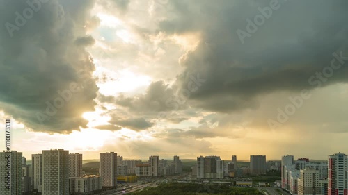 Ekaterinburg, Russia. The new residential area Akademichesky against the backdrop of a bright sunset. After the day comes the night. Timelapse photo