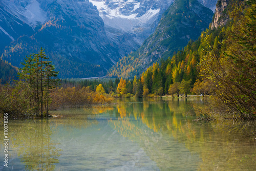 Stunning landscape and reflection of Landro lake in autumn, Dolomite Italy. photo