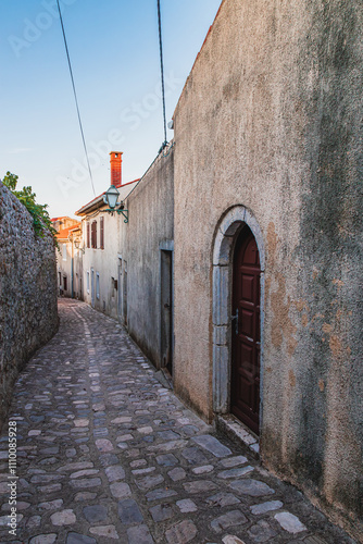 Fototapeta Naklejka Na Ścianę i Meble -  Krk Croatia 28.06.24A small cobblestone street to the city center