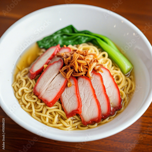 Malaysian wantan mee with char siu pork, egg noodles and chopped green onions