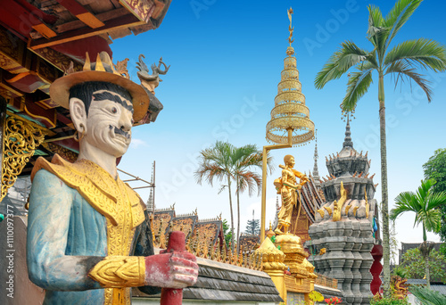 figure of Buddha and Buddhist palace in Xishuangbanna,China photo