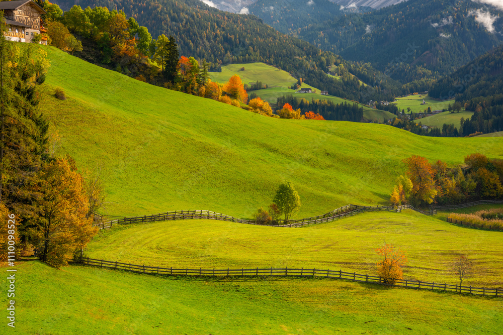 The specular landscape when you drive at Val di Funes area in Autumn season, Dolomite, Italy.