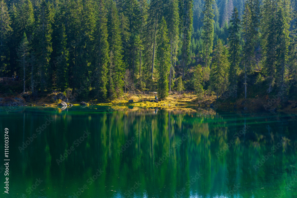 Stunning landscape and reflection of Karersee lake in autumn, Dolomite Italy. Stunning landscape and reflection of Karersee lake in autumn, Dolomite Italy.
