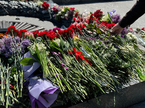 Flowers at the Tomb of the Unknown Soldier, war memorial  dedicated to the soldiers of the Soviet Army killed in the Second World War in Kyiv, Ukraine. photo