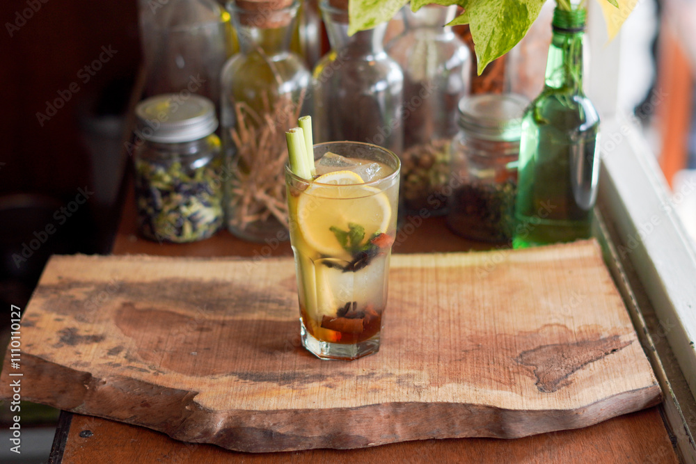 a Glass of Spices Herbal Drink Served on the Wooden Table a Glass of Spices Herbal Drink Served on the Wooden Table