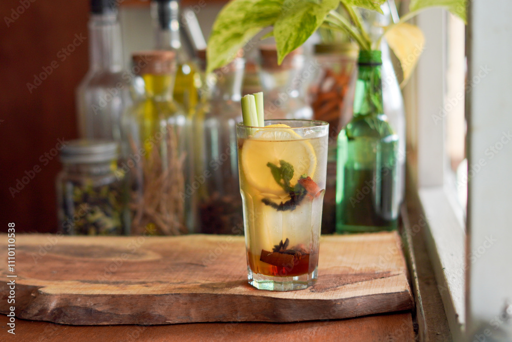 a Glass of Spices Herbal Drink Served on the Wooden Table a Glass of Spices Herbal Drink Served on the Wooden Table