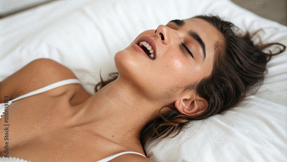 Young woman lies happily in bed After her first orgasm Young woman lies happily in bed After her first orgasm
