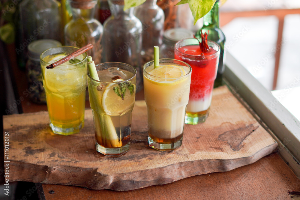 Fototapeta premium a Glass of Spices Herbal Drink Served on the Wooden Table