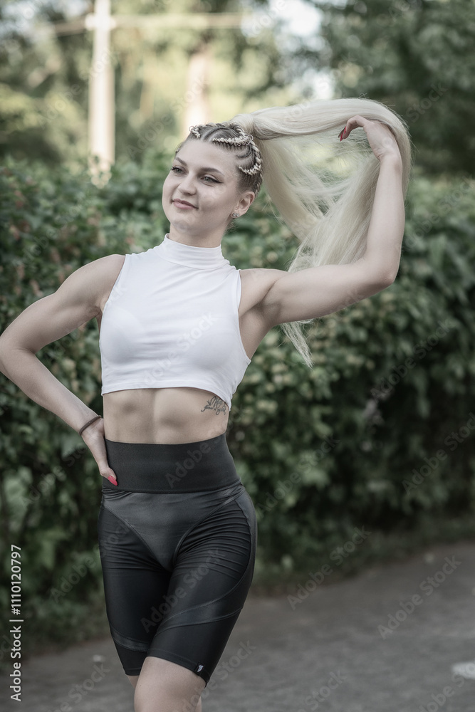 Portrait of a young beautiful athletic girl in the summer outdoors. Portrait of a young beautiful athletic girl in the summer outdoors.