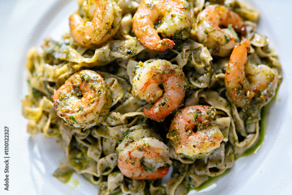 seafood pasta in pesto sauce