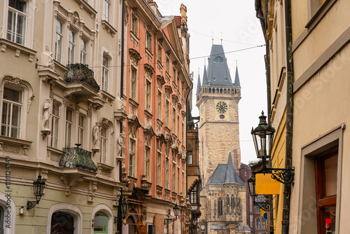 Picturesque houses in the streets of Prague with the town hall tower in the background, Czech Republic.