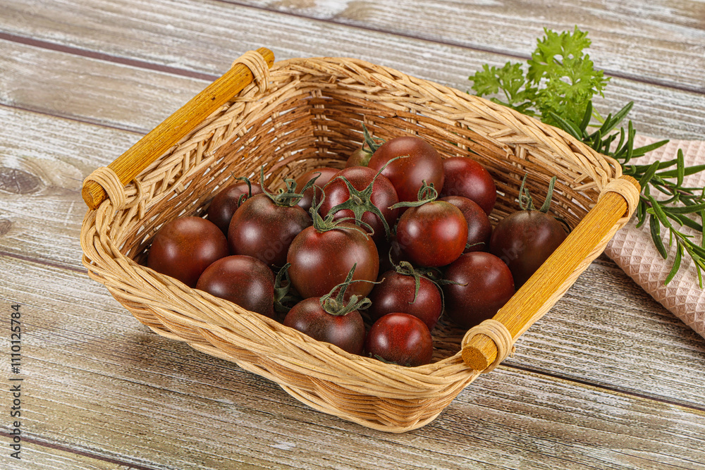 Juicy ripe black cherry tomato