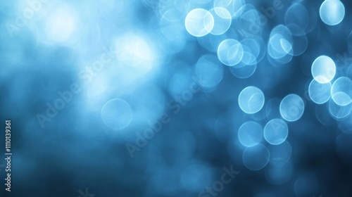 Abstract bokeh effect with soft circles of light in cool blue tones, blurred and dreamy