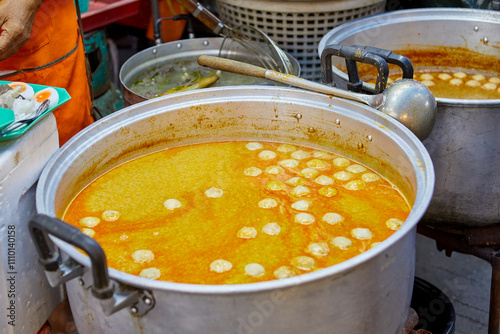 Fish Curry Sauce with Thai Rice Noodles  in market photo