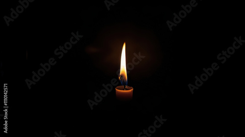 Minimalistic composition of a single candle burning in the dark