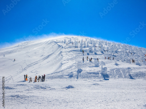 Snowy mountain half covered with ice monsters (Zao, Yamagata, Japan) photo