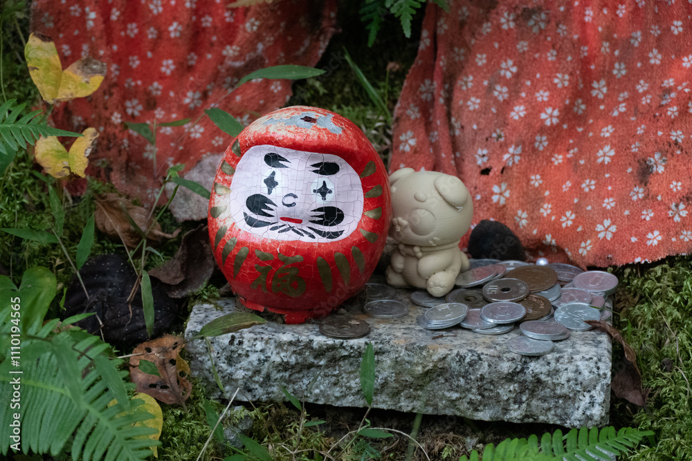 Daruma doll, is a hollow, round, Japanese traditional doll modeled after Bodhidharma, the founder of the Zen tradition of Buddhism. These dolls, though typically red and depicting the Indian monk