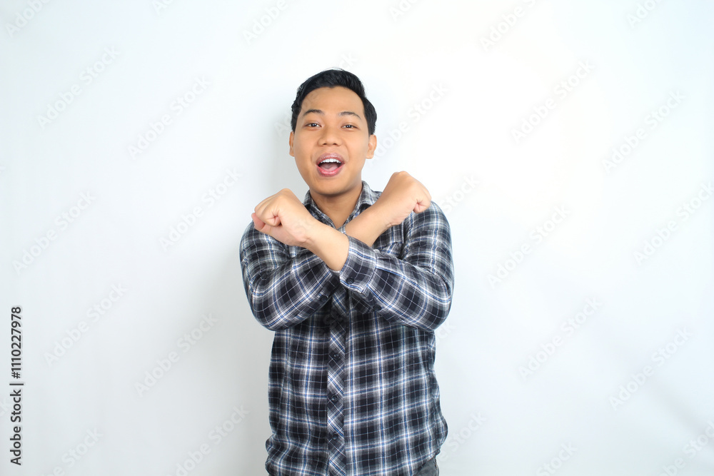 asian man show stop signs with smiling face isolated on white background asian man show stop signs with smiling face isolated on white background