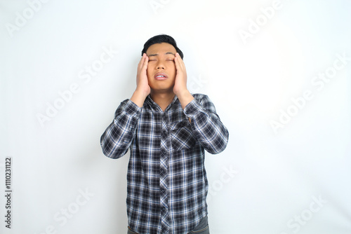 unhealthy asian man feel migraine and fatigue isolated on white wearing casual shirt