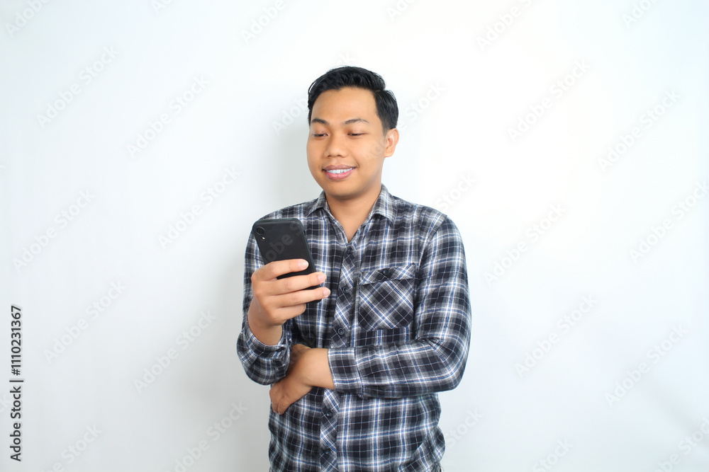 portrait of smiling asian man using smartphone wearing casual shirt isolated on white portrait of smiling asian man using smartphone wearing casual shirt isolated on white