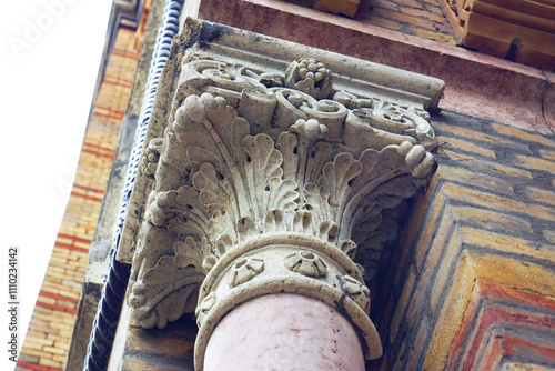 Close-up of the Cetate Synagogue decoration in the Romanian city of Timisoara: the carved capital of the stone column installed in front of the portal. Decoration of the facade of the Jewish temple. photo