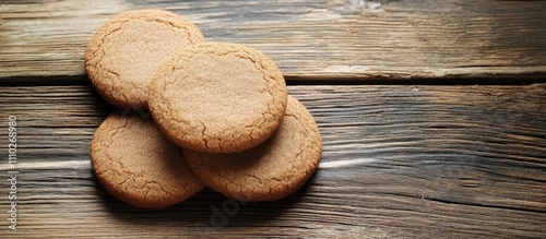 Traditional gingerbread cookies stacked on a rustic wooden surface showcasing homemade goodness and inviting warmth