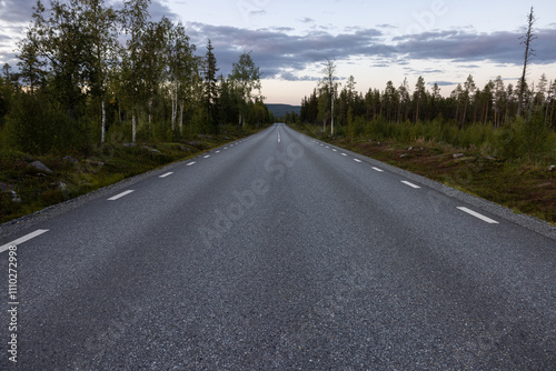 Empty road with a view on majestic mountains and the norwegian landscape in summer. photo