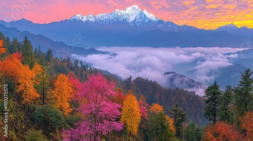 A stunning mountain landscape during autumn with colorful foliage and clouds.