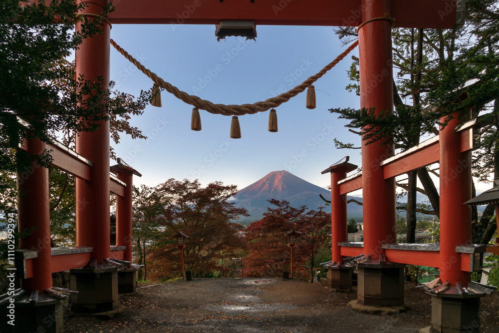 View of Mount Fuji through the torii gate of the Arakura Fuji Sengen Shinto Shrine on a sunny autumn day, Fujiyoshida, Yamanashi Prefecture, Japan. View of Mount Fuji through the torii gate of the Arakura Fuji Sengen Shinto Shrine on a sunny autumn day, Fujiyoshida, Yamanashi Prefecture, Japan.