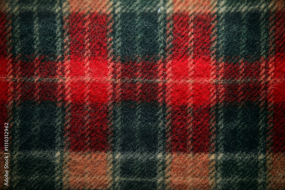 Red and green wool tartan fabric close-up with fuzzy texture