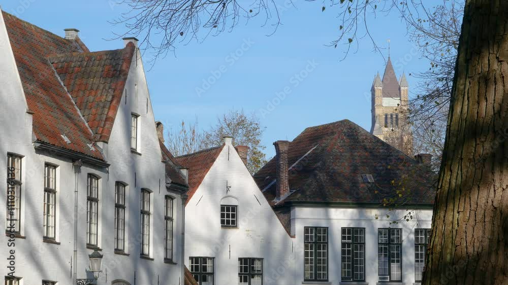 Belgium top site. Typical white painted houses in the quietness of Bruges Beguinage. Unesco World Heritage listed historic city.
