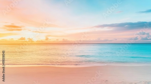 Travel image with a beautiful sunset over the ocean, with pastel clouds in the sky and sand on the beach