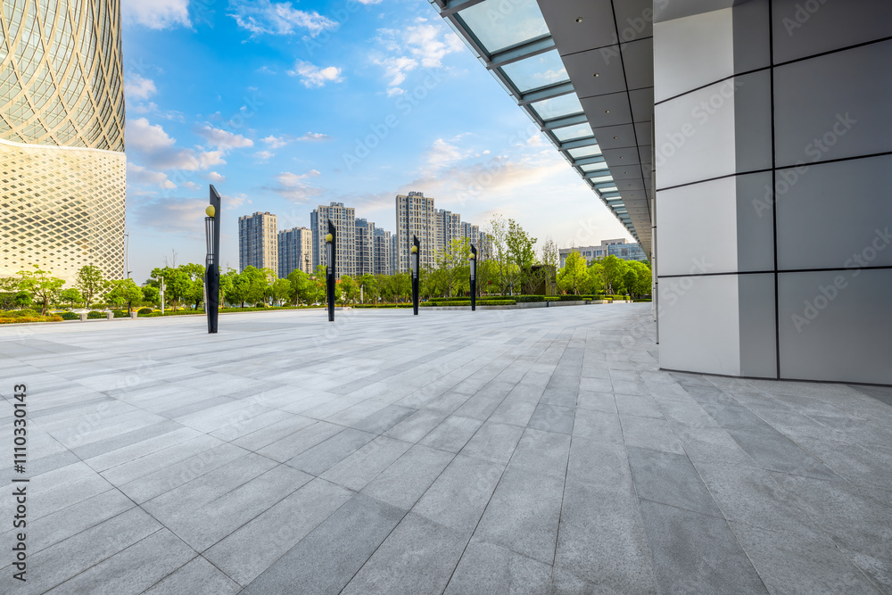 Fototapeta premium Empty brick floor and modern city buildings background