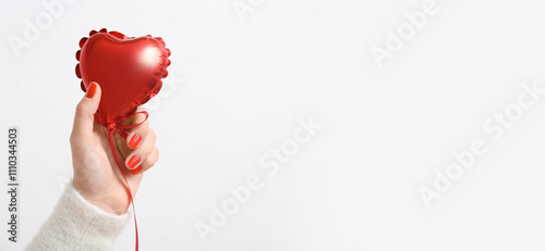 Female hand with red manicu...