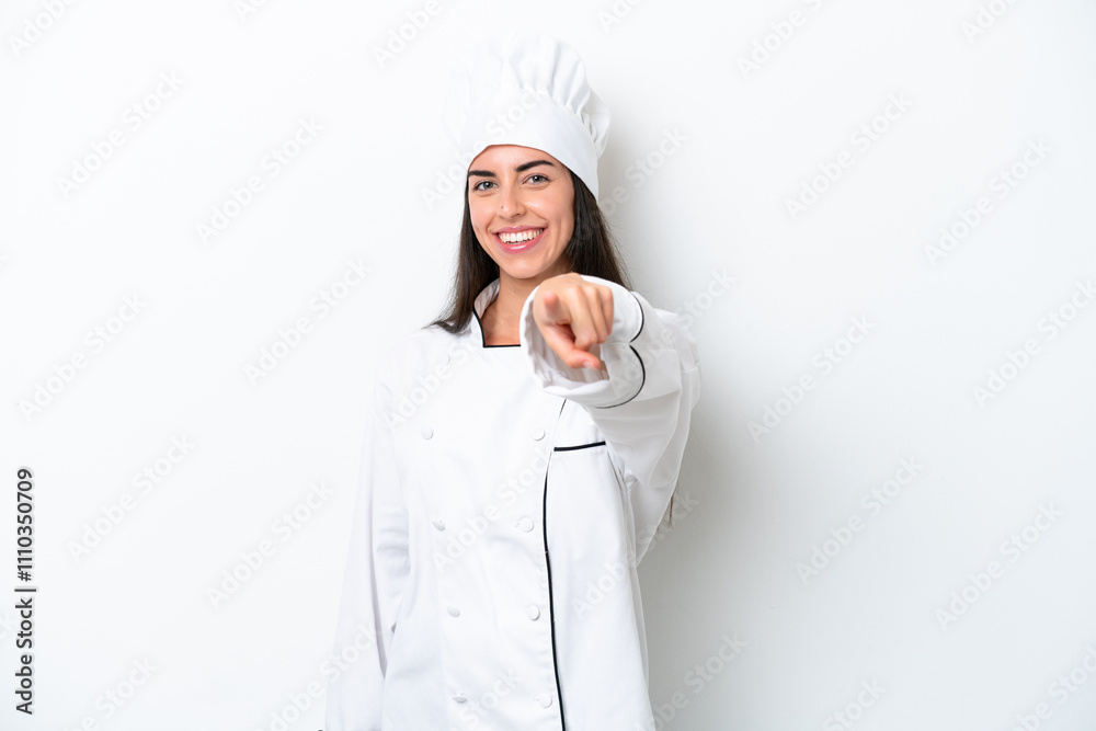 Young chef woman over white background points finger at you with a confident expression Young chef woman over white background points finger at you with a confident expression