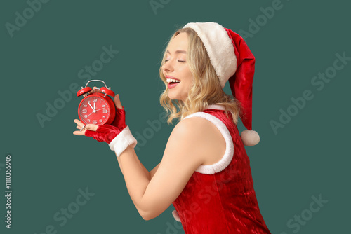 Happy young woman in santa ...