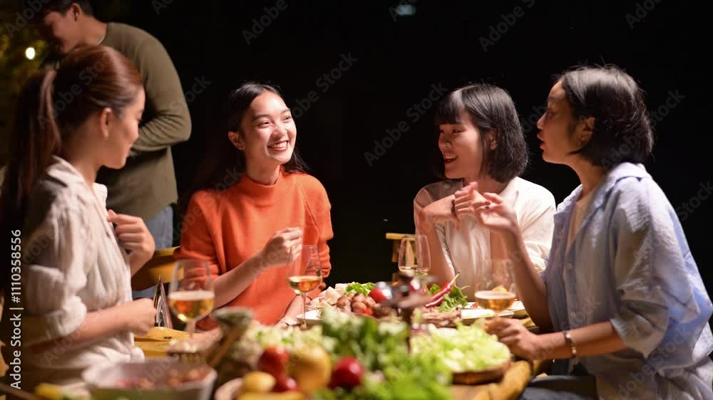 A group of women are sitting around a table with food and drinks. They are laughing and enjoying each other's company A group of women are sitting around a table with food and drinks. They are laughing and enjoying each other's company