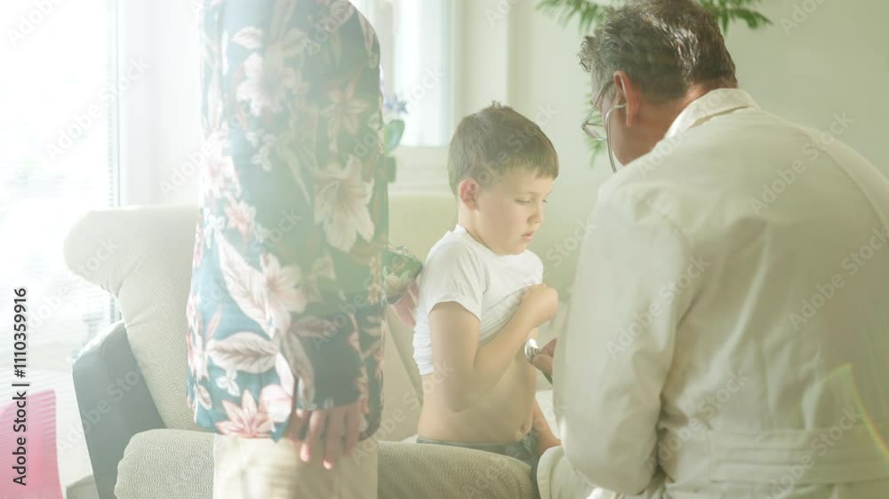 Doctor examines a boy using a stethoscope at home, with a parent standing nearby, creating a caring and attentive atmosphere. Concept of home healthcare, pediatric care, and family support Doctor examines a boy using a stethoscope at home, with a parent standing nearby, creating a caring and attentive atmosphere. Concept of home healthcare, pediatric care, and family support
