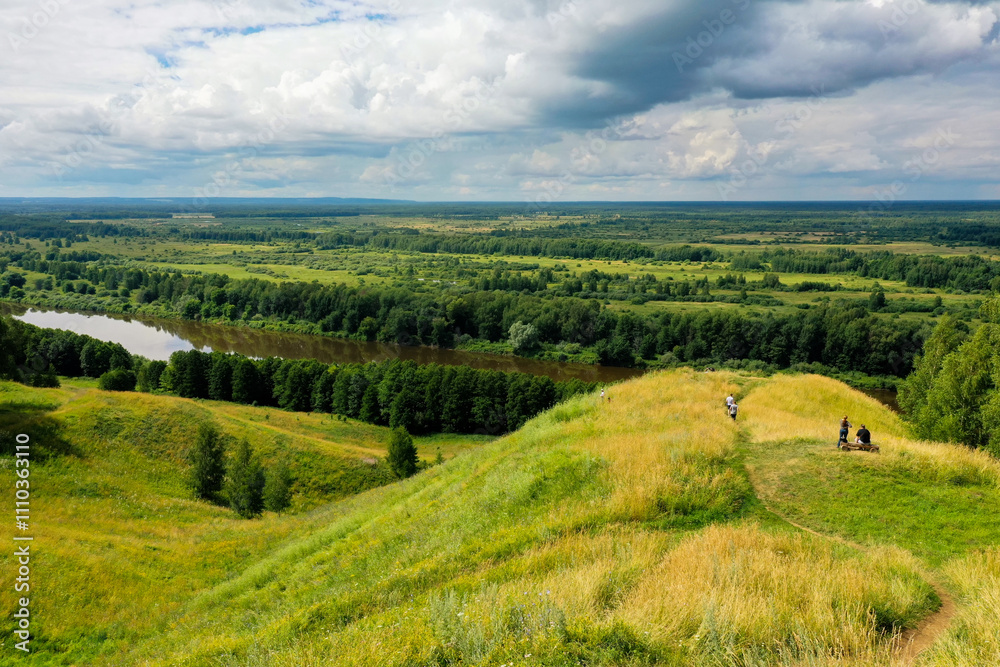 Naklejka premium Lush hills beside the winding Klyazma River invite visitors to explore the tranquility of Gorokhovets.