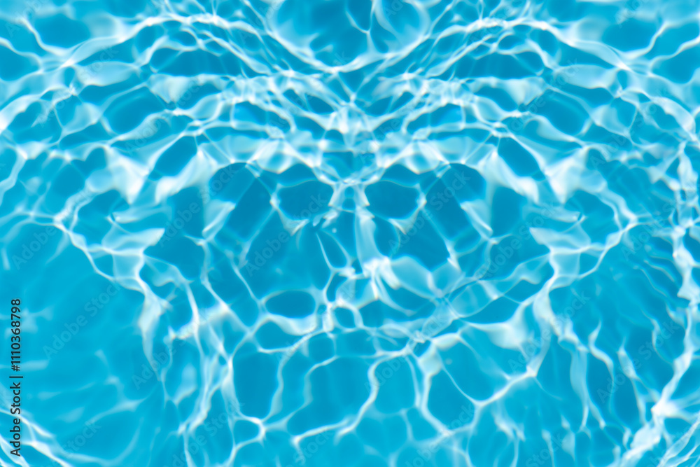 Obraz premium Blue water with ripples on the surface. Defocus blurred transparent blue colored clear calm water surface texture with splashes and bubbles. Water waves with shining pattern texture background.